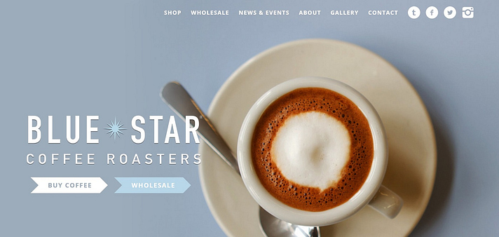 A picture of Blue Start Coffee Roaster's website header, featuring a foamy cup of coffee. 